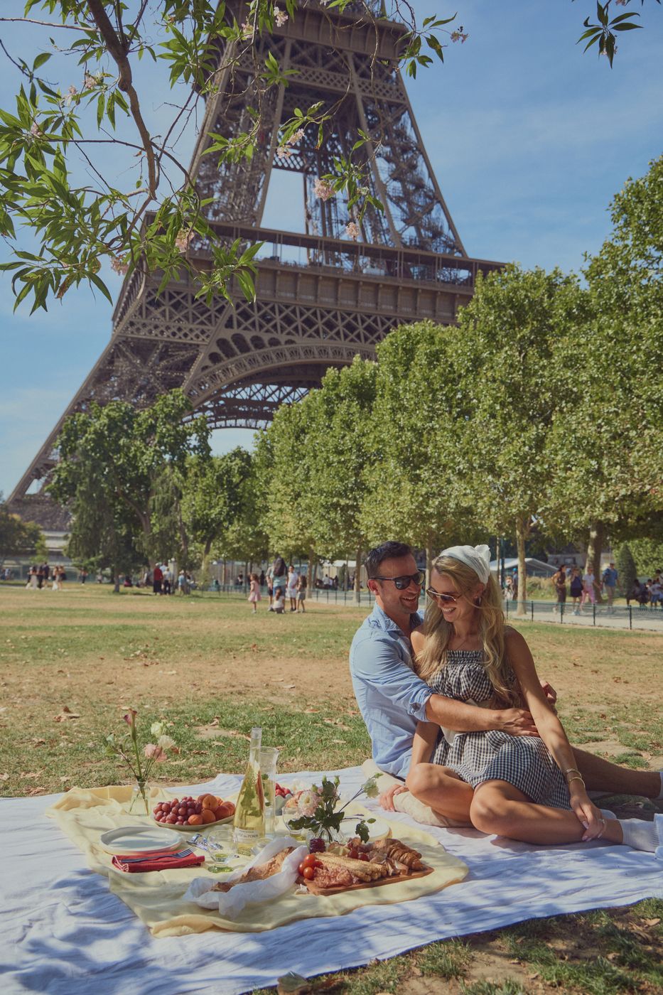 Couple on a floral picnic by the Eiffel Tower